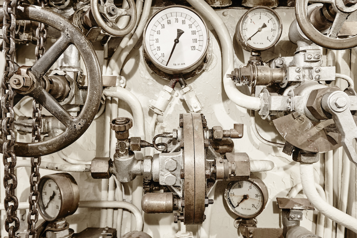 A sepia image of old pressure valves